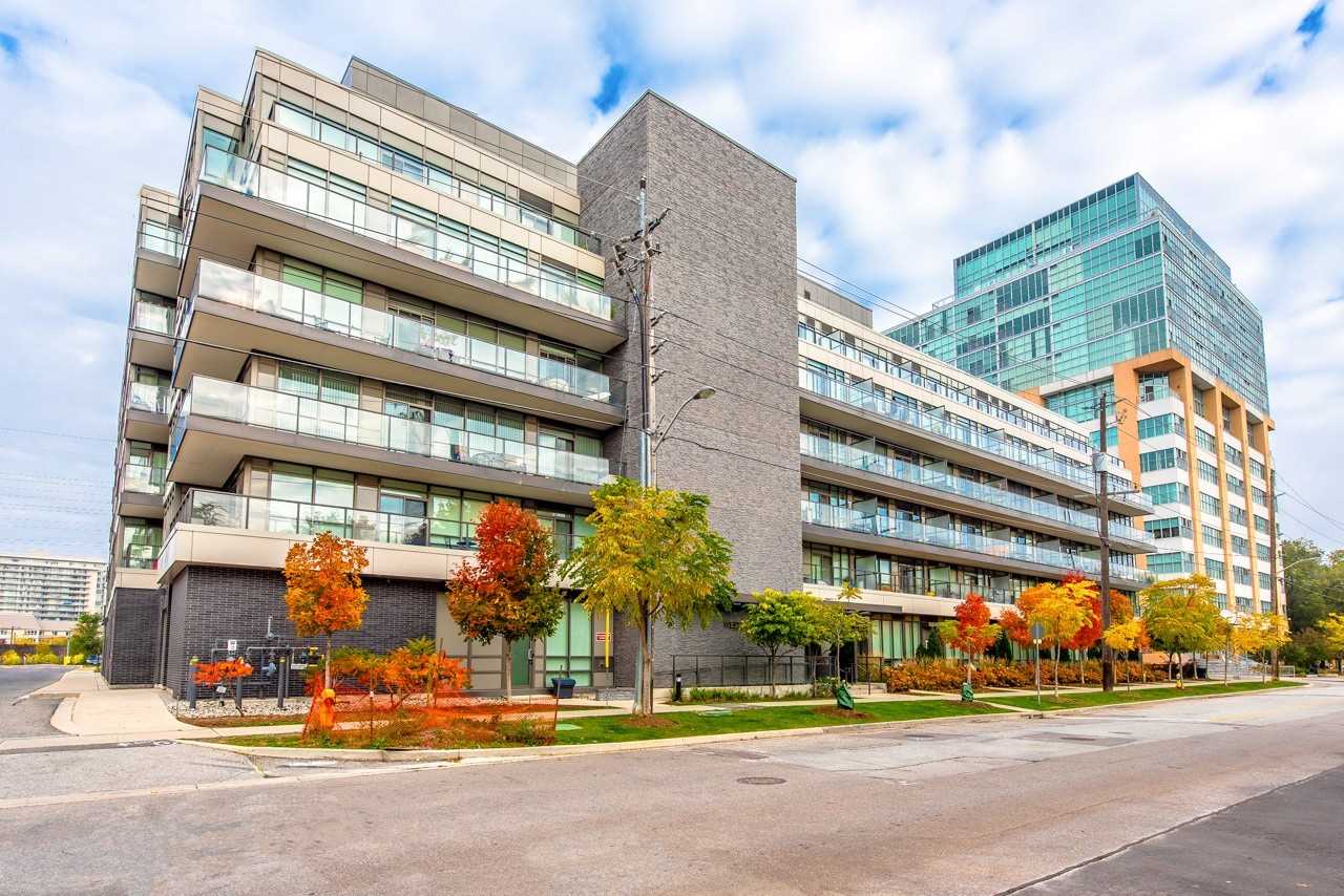 422-8 Fieldway Road condos in Islington, Etobicoke. Modern low-rise condo building with glass balconies and fall foliage.